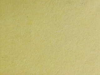 Obraz premium Superficie de papel granulado en color amarillo pálido con textura de fibra