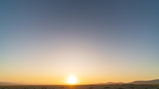 Holy Grail time-lapse in Atacama Desert showing sunset, zodiacal light, and Milky Way stars before coastal clouds cover the sky over a flowered plain.