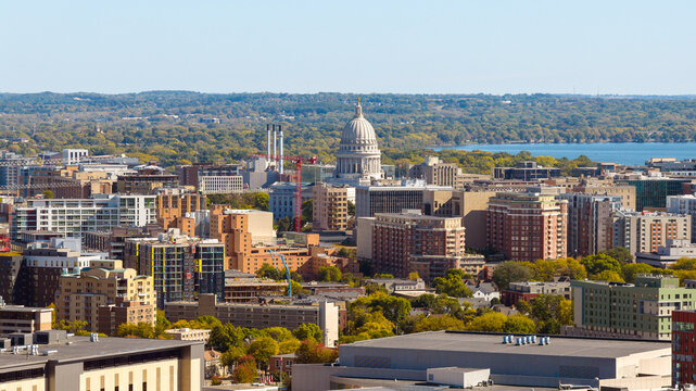 An aerial view of downtown Madison, WI with the historic Wisconsin State Capitol building in the middle.