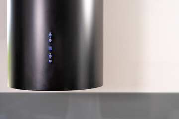 Modern kitchen extractor hood with illuminated control panel