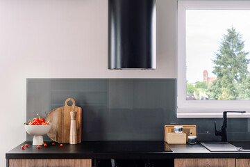 Modern kitchen space with induction hob and new appliances in apartment setting