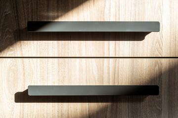 Modern kitchen cabinet drawers with black contemporary handles