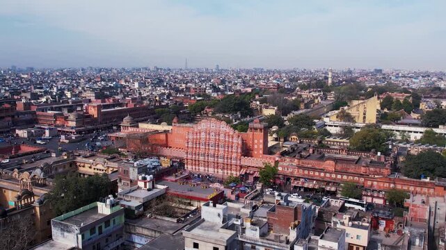 Hawa Mahal in Jaipur showing iconic pink sandstone architecture and historic palace facade, popular tourism landmark in Rajasthan, India.