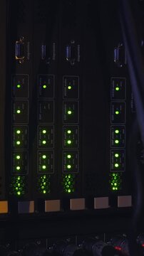 Music concert rack with blinking lapms on mixer, equaliser, compressor and amplifier. Vertical footage