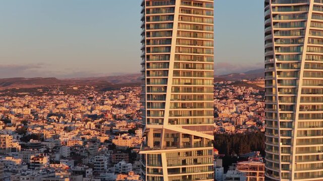 Aerial drone view of contemporary high rise architecture in Limassol city center