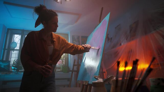 Female Painter Captured During Dusk With Lively Brushstrokes And Cozy Ambiance