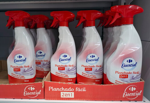 DENIA, SPAIN - December 10, 2025.Bottles of Carrefour Essential Planchado facil ironing spray on supermarket shelf in Spain ready for customers to buy