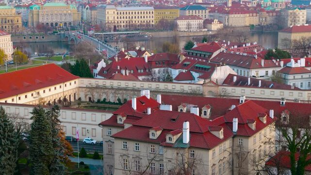 Prague cityscape zooming into lesser town red roofs. Historic buildings with traditional red roofs in prague's mala strana district, with a slow zoom revealing the architectural details