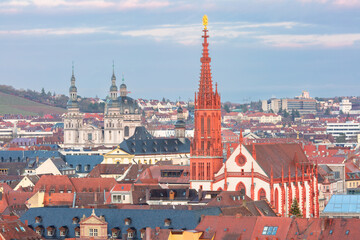 Obraz premium View of Wurzburg city center with cathedral towers, church domes and historic rooftops in Germany.