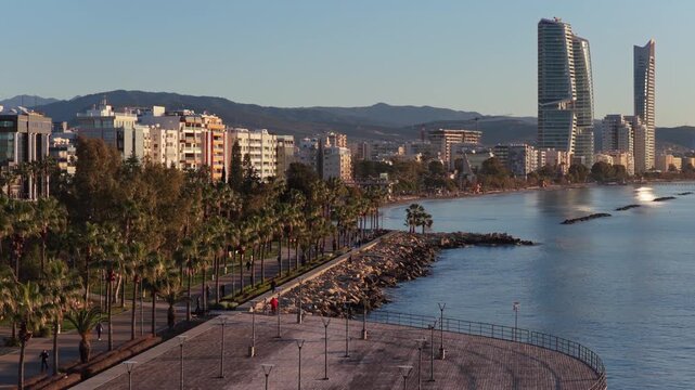 Aerial drone view of a wooden pier extending into the Mediterranean Sea in Limassol, Cyprus