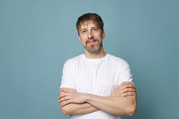 Fototapeta premium Portrait of handsome man on light blue background