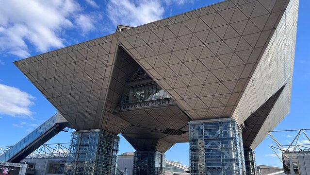 Tokyo Big Sight international exhibition center featuring the iconic inverted pyramid conference tower architecture under a blue sky in Ariake - Tokyo, Japan, October 15, 2024