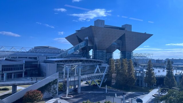 Tokyo Big Sight international exhibition center featuring iconic inverted pyramid architecture under a clear blue sky in the Odaiba district - Tokyo, Japan, November 12, 2024