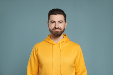 Fototapeta premium Portrait of handsome man on light blue background