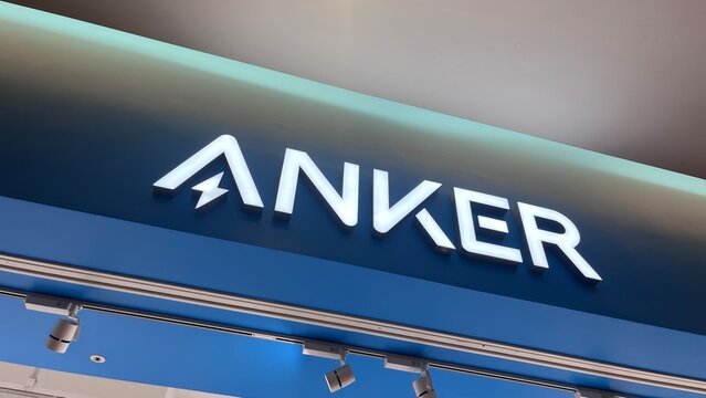 Anker store front illuminated logo and retail signage with modern blue lighting and spotlight fixtures at a shopping mall in Osaka - Osaka, Japan, September 24, 2024