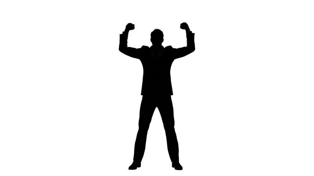 Man silhouette with arms raised celebrating success
