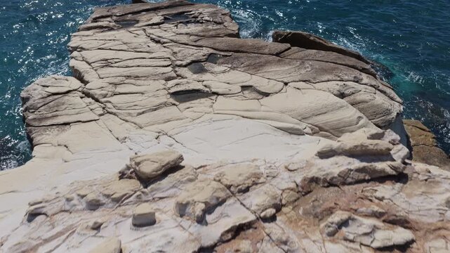 Aerial drone view of layered rock formations along the Cyprus coast