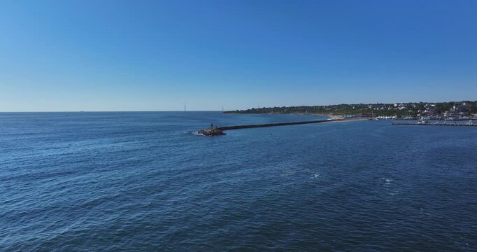New Shoreham, RI, USA - August 8, 2026  Block Island, Rhode Island summer arial video of the breakwater barrier at Old Harbor.