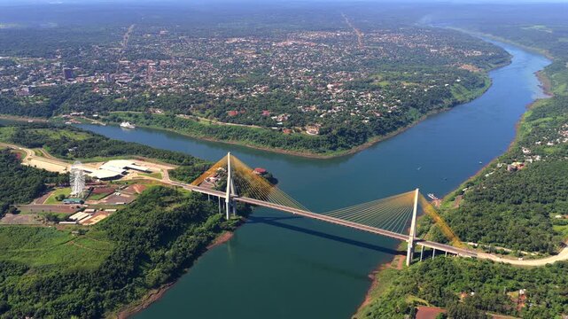 Striking aerial of Ponte da Integra&ccedil;&atilde;o cable-stayed bridge over Paran&aacute; River at Triple Frontier junction.