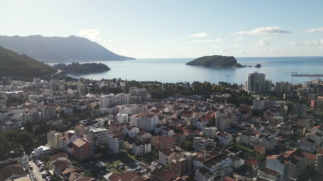 Morning panorama of Budva coastal city under bright sun, southern Montenegro, Balkans.

