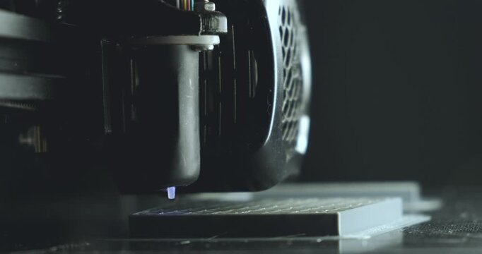 3D printer printing and building an object layer by layer, modern technology and manufacturing concept