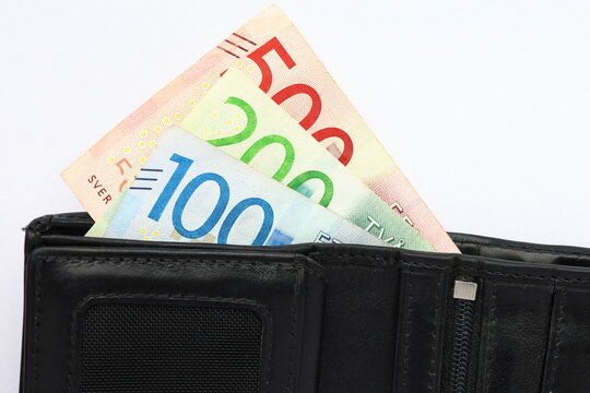 Black leather wallet or purse with swedish banknotes. Money concept