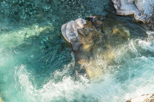 Canada, Alberta, Calgary.  Fresh, mountain water rushing over rocks in the Sheep River Falls.  Sheep River Provincial Park.