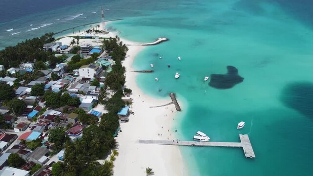 Maldives Aerial Drone Fulidhoo Tropical paradise Island in turquoise blue water with tropical white sand beach and palm trees  