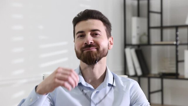 Portrait of happy handsome businessman in office