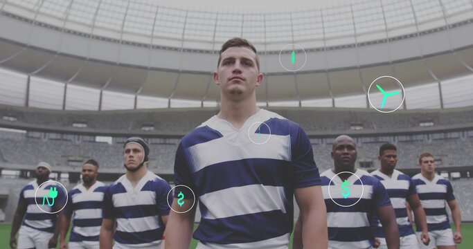 Standing center rugby player wearing striped jersey, white shorts in stadium, showing AR icons