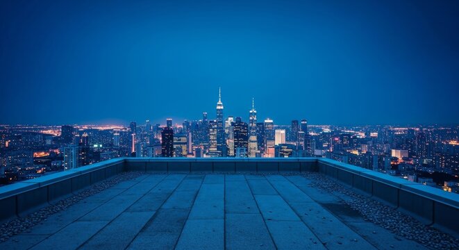 An isolated urban vantage point on a high rooftop overlooks a vast glowing city skyline under a deep blue and melancholic twilight sky, space, rooftop, exterior