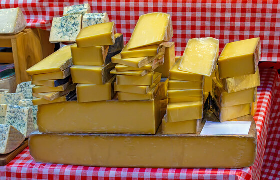 Large homemade organic selection of cheese on retro market stall