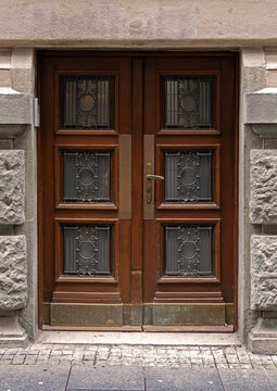 Closed vintage entrance door outside on city street