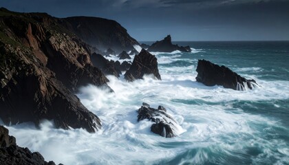 Fototapeta premium Dark Jagged Cliffs Confront the Churning White Fury of a Turbulent, Moody Ocean.