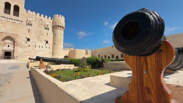 Row of ancient cannons at Citadel of Qaitbay historic fortress entrance