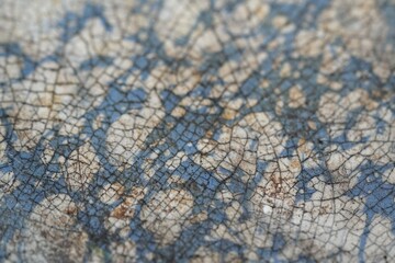 Fototapeta premium Close up of a vintage antique enamel frying pan showing the patina on the surface and signs of rust.