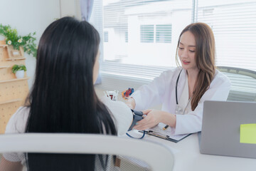 An Asian female physician reviews the medical histories of patients with cardiovascular disease. She focuses on the treatment of heart disease and analyzes data related to coronary artery disease.