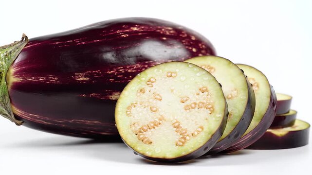 Fresh Eggplant Sliced and Whole on White Background Healthy Food.
