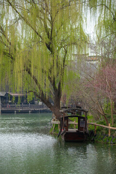 Timeless beauty of Wuzhen Water Town, with traditional boats sailing through narrow canals lined with classic Chinese architecture