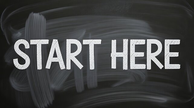 Start here text on chalkboard background motivation and guidance concept 