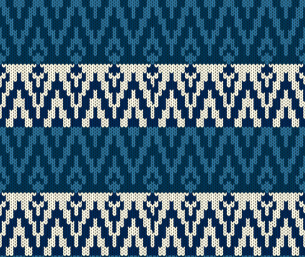 Seamless navy blue knitted pattern with cream chevron motifs. Winter wool sweater texture background featuring traditional ethnic ikat design.