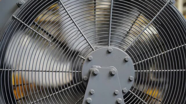 Closeup of a large industrial fan in motion.