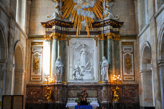 The sculpted marble high altar and sacred heart relief of the Basilica of Notre-Dame in Boulogne-sur-Mer, Pas-de-Calais, Northern France
