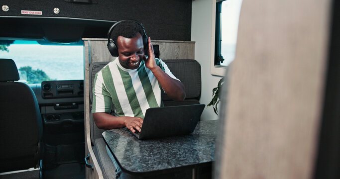 Dance, headphones or black man in caravan with laptop, audio app or listening to music in remote work. Happy, trailer or freelancer with tech, feeling beat or radio subscription in online report.