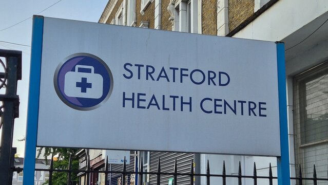 London, UK 02.07.2025 Stratford Health Centre sign with medical cross symbol on street facade highlighting public healthcare access, local clinic services and urban community infrastructure