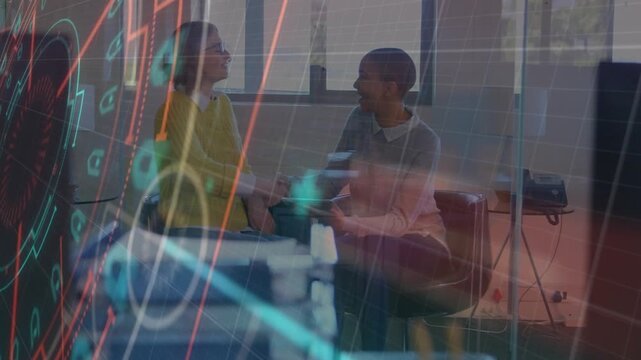 Two women consulting in business lounge, tapping device, driving animated data HUD, agreeing