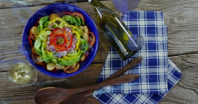 Blue salad bowl center-left, camera pulling back revealing bottle, lens flare, wine for food ad