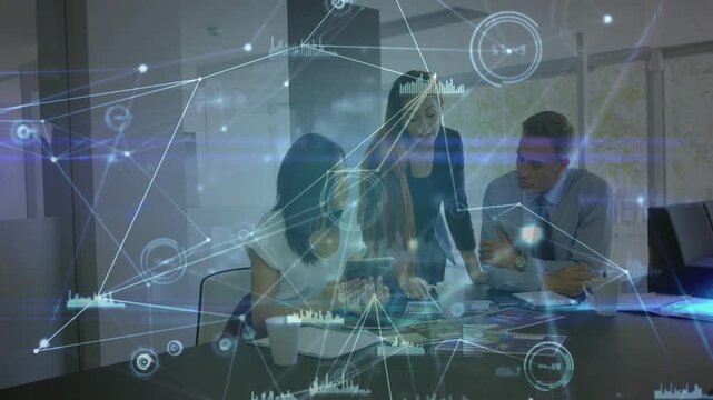 Standing lead leaning and pointing peer tapping tablet nodes syncing charts team aligning biz plan