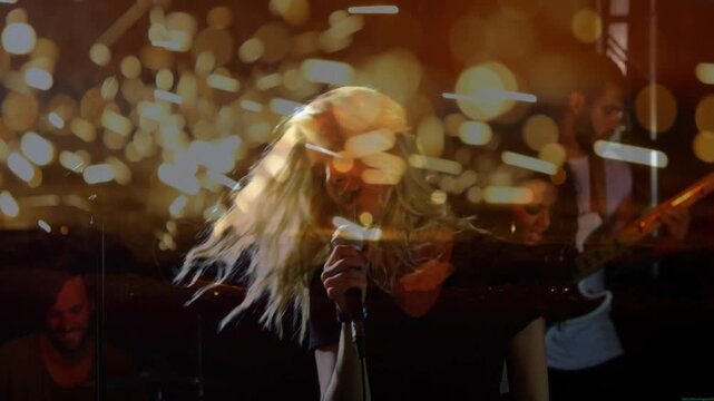 Shot cutting closeup female singer singing performing flipping hair bokeh rising band playing