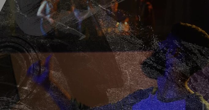 Bearded audio technician adjusting mixing faders and tapping lit buttons, controlling live band mix